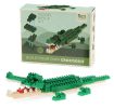 Completed crocodile brick model displayed beside its packaging box.
