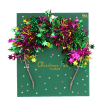 Festive Christmas party headband with colourful tinsel and star decorations.