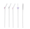 Four reusable glass drinking straws with colourful bow toppers and cleaning brush