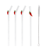 Four reusable glass drinking straws with red chilli toppers and cleaning brush