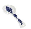 White ceramic spoon rest with blue fish design.