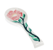 White ceramic spoon rest with blue fish design.