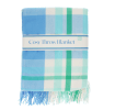 Blue, green and white check blanket folded.