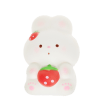 White bunny squishy toy holding a strawberry, with pink paw details and strawberry hair accessory.
