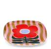 Square metal trinket tray with bold red flower design on a pink striped background.