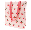 Light pink shopping bag with cherry print design and matching pink carry handles.