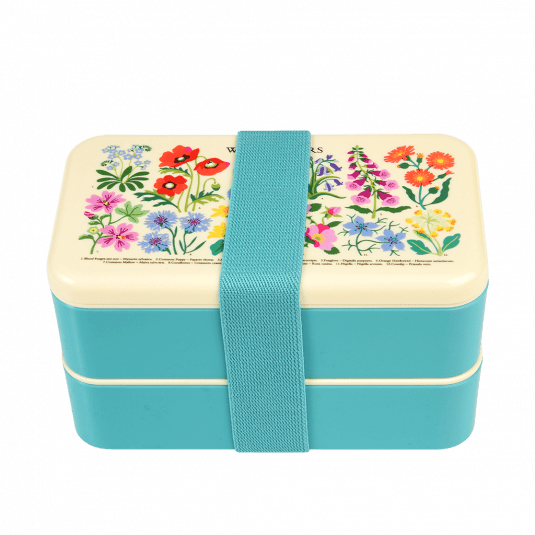 Turquoise adult bento box with cream lid and middle tray plus turquoise elastic strap featuring wild flower pattern