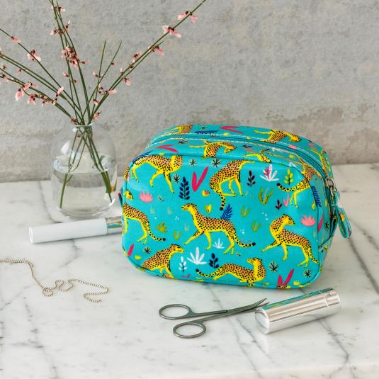 Turquoise oilcloth makeup bag with print of cheetahs