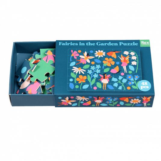 Fairies in the Garden puzzle pieces inside box