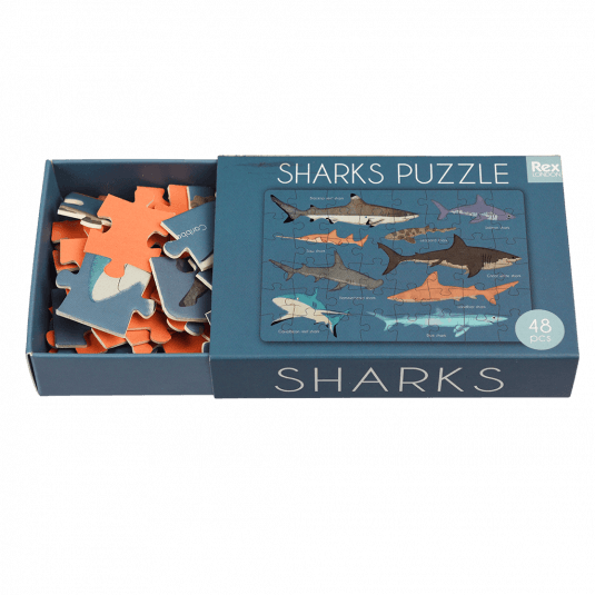 Shark puzzle pieces inside box