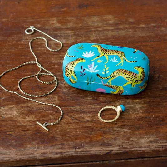 Turquoise mini travel case with print of cheetahs with jewellery to fit inside