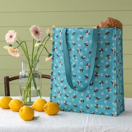 Turquoise shopping bag with print of bumblebees