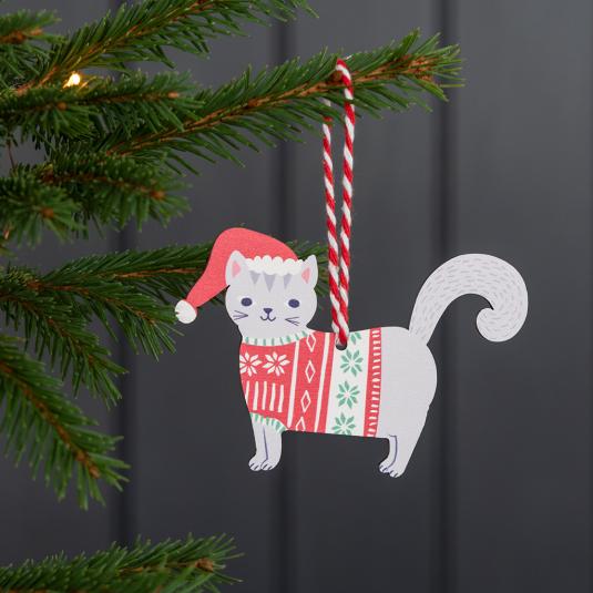 Wooden Christmas decoration of grey cat wearing festive jumper and hat hanging on tree