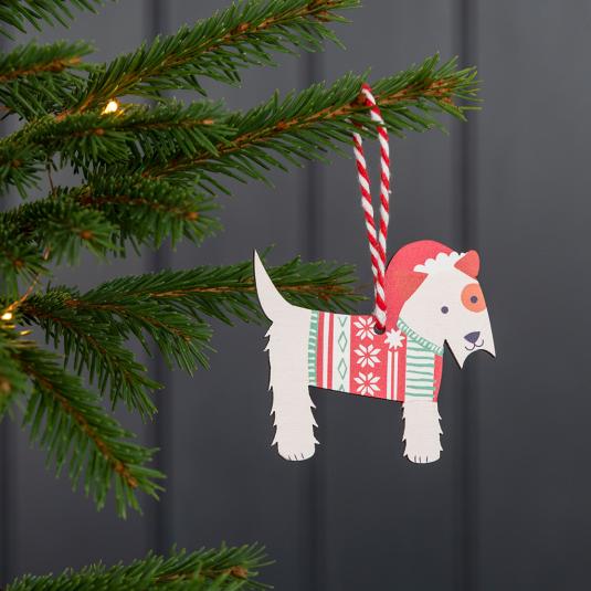 Wooden Christmas decoration of Scottie dog wearing festive jumper and hat hanging on tree