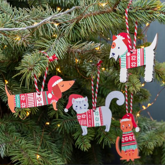 Wooden hanging Christmas decorations dogs and cats collection on tree