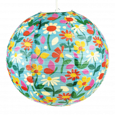 Paper lampshade with illustrations of butterflies among flowers fully assembled and hung from light fitting