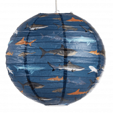 Paper lampshade with illustrations of sharks fully assembled and hung from light fitting