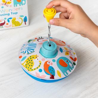 Colourful spinning top toy with a box in the background