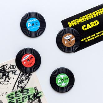 Four colourful mini vinyl record magnets  