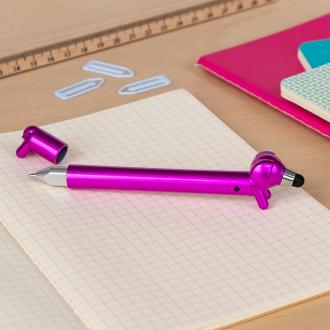 Pink sausage dog stylus ballpoint pen with cap off, lying on a notebook