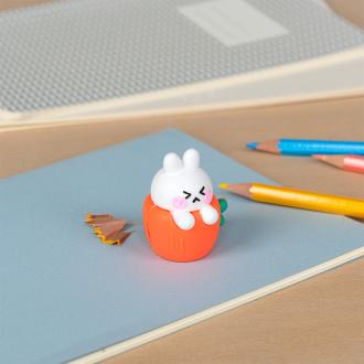 Rabbit-shaped pencil sharpener with coloured pencils placed beside