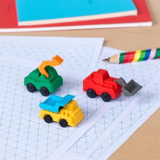 Four construction vehicles-shaped erasers in different styles and colours