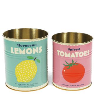 Two vintage-style storage tins, one with a lemon print and one with a tomato print.