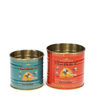 Two storage tins, one small and one large, featuring bees, flowers, and beehive illustrations.