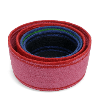 Stacked woven storage baskets in varying sizes and colours