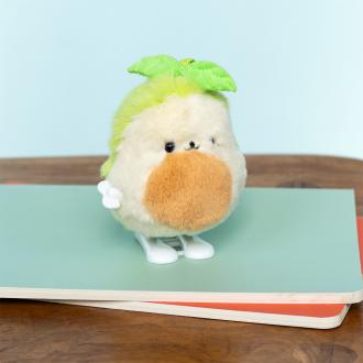 Plush avocado-shaped wind-up toy with green leaves 