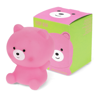 Pink teddy bear night light shown next to its packaging box 