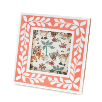 Square pink picture frame with white leaf patterns on the border.