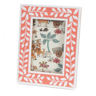 picture frame with a pink border and white leaf patterns