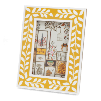 picture frame with a mustard yellow border and white leaf patterns