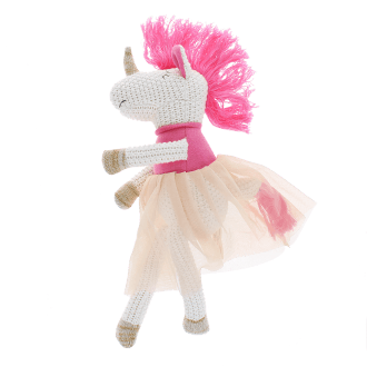 Knitted unicorn toy wearing a pink top and skirt