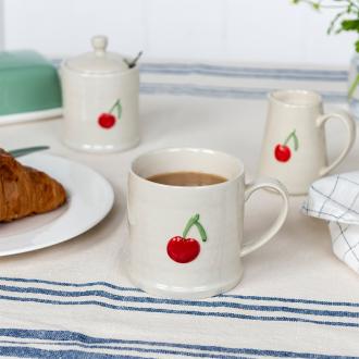 Stoneware mug featuring cherry print with handle 