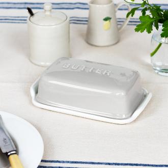 Rectangular butter dish with grey lid embossed with the word 'BUTTER