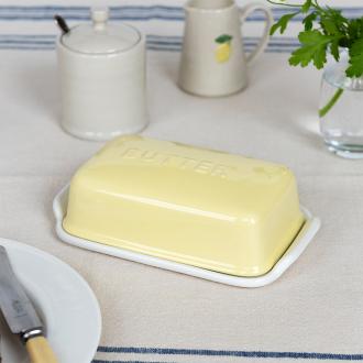 Rectangular butter dish with yellow lid embossed with the word 'BUTTER