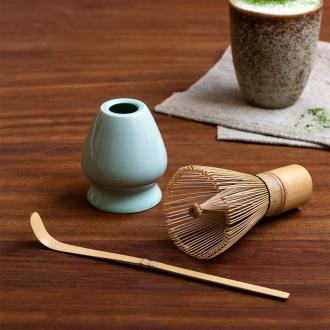 Matcha whisk set with bamboo whisk in container, ceramic holder, and bamboo scoop