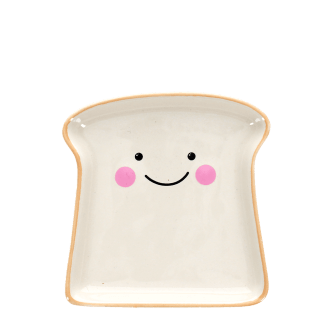 Ceramic trinket dish shaped like a slice of bread with a smiling face and pink cheeks