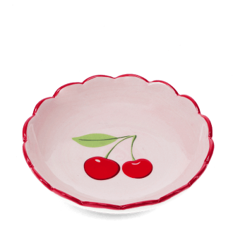 round ceramic trinket dish with scalloped red edge and cherry design in the center