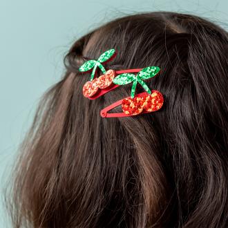 Pair of red glitter cherry hair clips with green glitter leaves