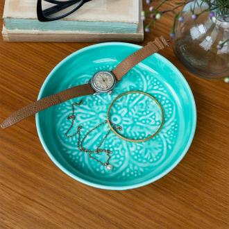 Enamel trinket dish in aqua displayed with a watch and jewellery