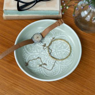 enamel trinket dish in light grey displayed with a watch and jewellery