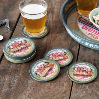 Four round coasters with vintage German beer design and storage tin
