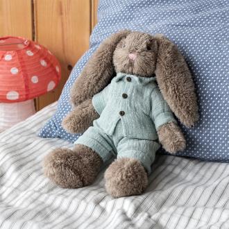 Plush bunny toy with floppy ears, wearing light green shirt and pants
