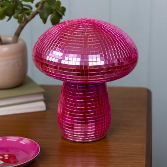Pink disco mushroom-shaped table lamp with mirrored tiles.