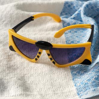 sunglasses with yellow tiger design, black stripes, and dark lenses.