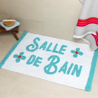 A tufted bath mat in blue and teal with the word “Salle De Bain” on the surface.