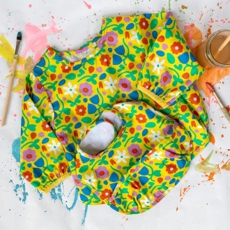 Bright floral bib and vest set with matching colourful pattern